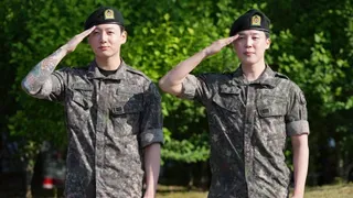 Fans Greet K-pop Stars Jimin and Jung Kook of BTS Discharged from Military Service